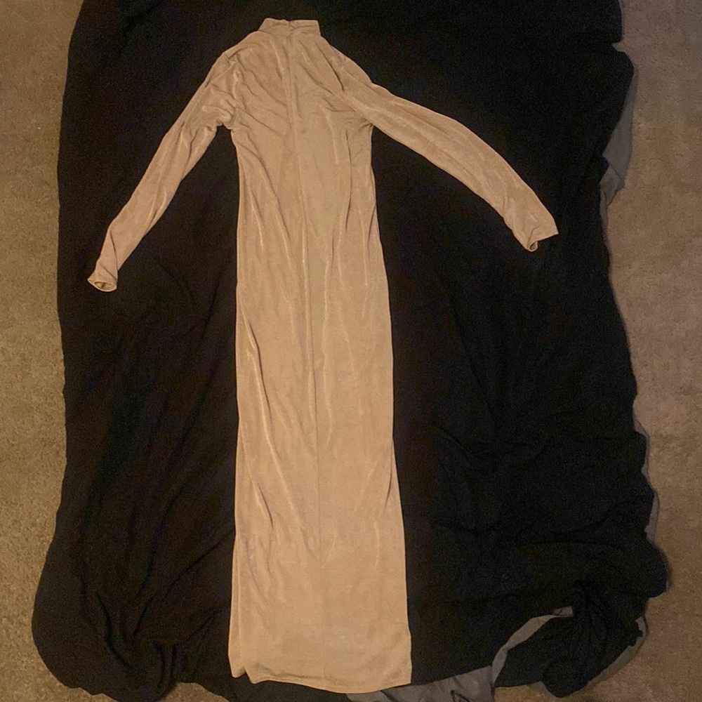 This is a turtle neck dress and it’s gold and shiny
